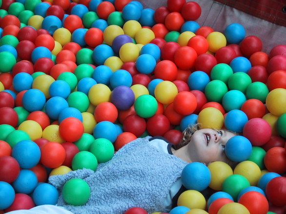 child with color balls