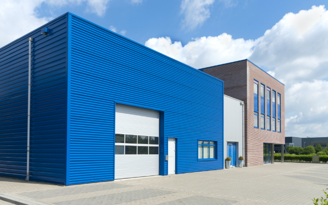 commercial shop space with large panel garage door