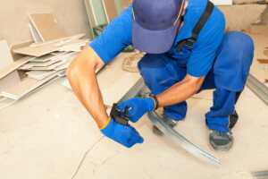 garage door technician installing sectional door track